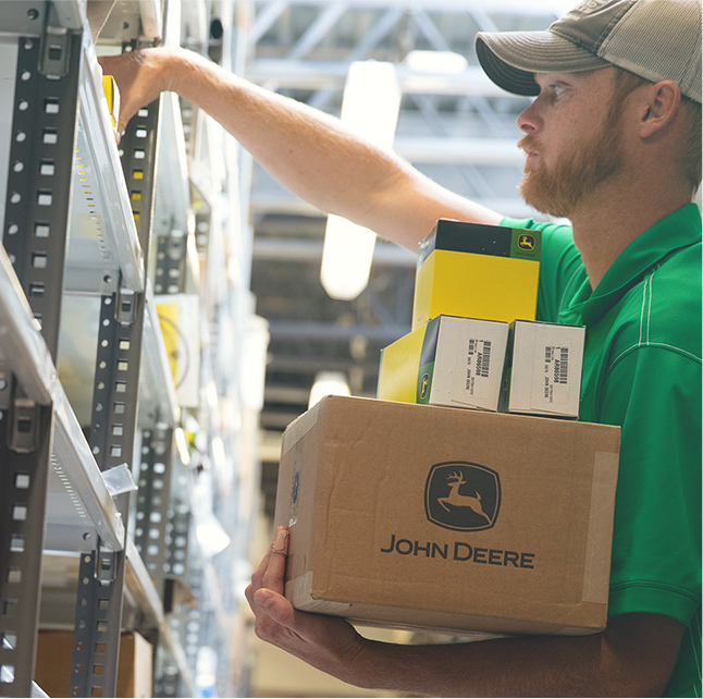 John Deere employee in warehouse
